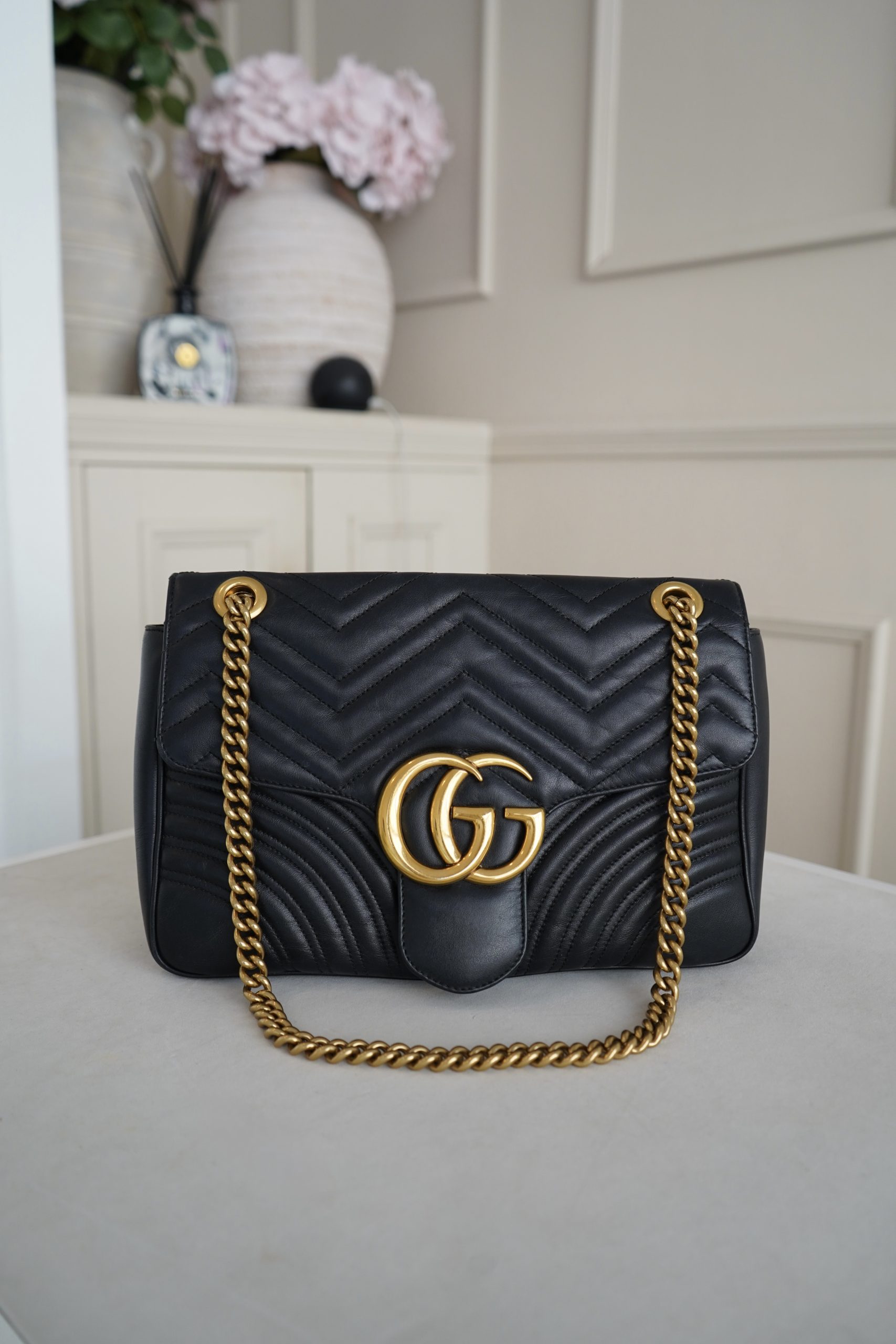 Gucci GG Marmount Shoulder Bag Crafted From Black Quilted Matelasse Leather And Gold Toned Hardware.